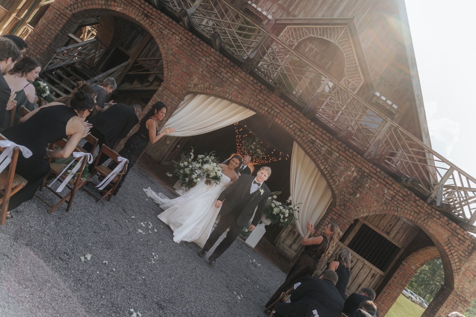 Confetti exit outside a brick venue after the ceremony