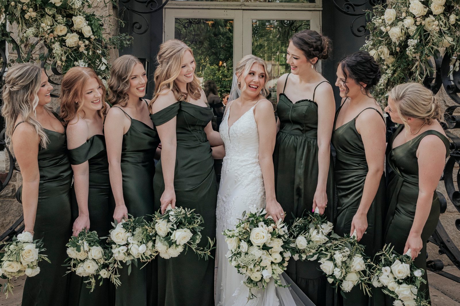 Bride laughing with her bridesmaids before the ceremony
